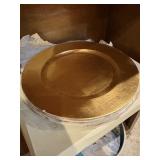 Four NIB gold tone charger plates, 13 inches