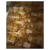 Seven Amber glass goblets, wildflower pressed