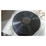 Stack of vinyl records (no covers)