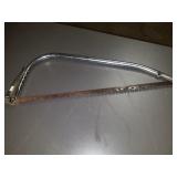 Handsaw and caulk gun