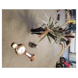 Vase, racoon statue, galileo thermometer