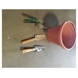 Plastic pot and garden tools