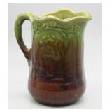 APPROX 6" BROWN & GREEN POTTERY PITCHER (CHIP)