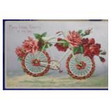 SHIP: 1909 DATED "HAPPY RETURNS" BICYCLE POSTCARD