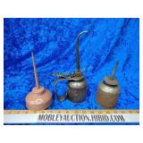 Three vintage oil cans