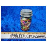 Vintage ball jar filled with beads