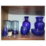 Blue glass shelf full