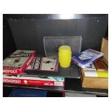 Games on shelf old Monopoly with wooden homes and