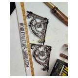 Two cast iron shelf brackets