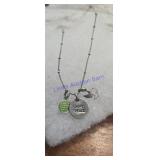 silver charm necklace featuring a 'HOPE PEACE'