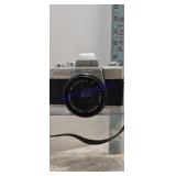 vintage Minolta SRT 100 35mm film camera with a