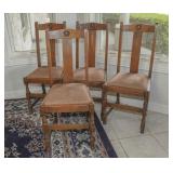 Four oak dining chairs