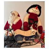 Santa, snowman and Christmas sled