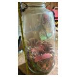 Mason jug with coins