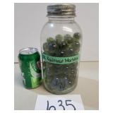 About 102 Railroad Marbles in Glass Jar