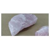 Rough, unpolished rose quartz, a pink variety