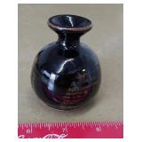 Small, dark iron-glaze or tenmoku studio pottery