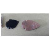 Two hand-knapped stone arrowheads