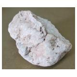 Rough mineral specimen that resembles tugtupite