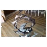 Metal Dolphin sculpture on wooded base