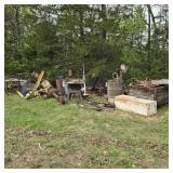 Large Pile of Scrap Metal in Field