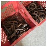 Antique Couplers & Railroad Spikes in Red Crates