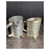2 VINTAGE FLOUR SIFTERS W/ GREEN & BROWN HANDLES