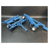 Vintage Ertl USA disc harrow and a bottom plow