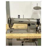 JUKI COMMERCIAL SEWING MACHINE DDL-227 ON STAND.