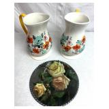 Floral themed pitchers and wall hanging