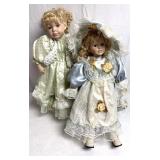 2 Porcelain dolls/ one is cracked