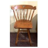 Wooden swivel barstool seat is 25 inches tall