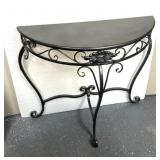 Stand featuring decorative wrought iron