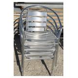 Four stackable decorative patio chairs