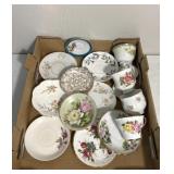 Non-matching tea, cups, and plate plates