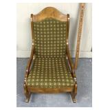 Vintage low profile rocker with a green fabric