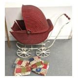 Antique stroller with quilted interior cushions