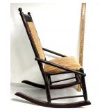 antique Victorian-style rocking chair features a