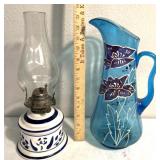 Glass floral design pitcher/oil lamp top is loose