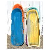 Retro plastic snow sleds some may have cracked