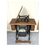 Vintage singer, sewing machine with thread
