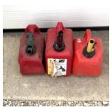 3 small plastic gas cans