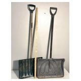 2 plastic snow shovels