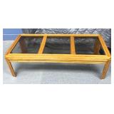 Wooden coffee table with glass inserts on top