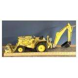 Vintage Ford tractor with backhoe and front