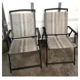 Two fold up lawn chairs