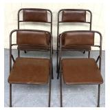 Four folding chairs, some tears