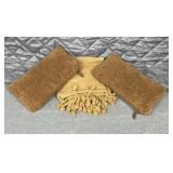 Brown throw blanket with two pillows