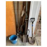 Shovels, conduit, items in corner