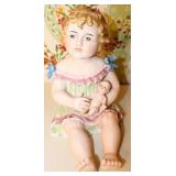 Antique German Bisque Piano Baby holding Doll
